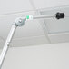 A close up of a Unger zinc cranked joint angle adapter on a metal pole.