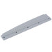 A grey rubber scrape with holes on a metal bar.