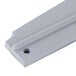A gray rubber piece with two holes on it.