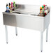An Eagle Group underbar cocktail and ice bin with bottle holders filled with drinks.