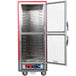 A red and silver Metro C5 holding and proofing cabinet with clear Dutch doors open.