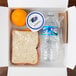 a box with food and a bottle of water