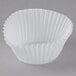 A white fluted mini paper cupcake wrapper.