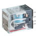A Frymaster relay with a blue and white object inside a clear plastic box.
