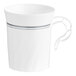 A white plastic coffee cup with silver accents and a decorative handle.