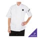 A person wearing a white Mercer Culinary chef jacket with short sleeves.