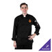 A man wearing a black Mercer Culinary chef jacket with cloth knot buttons.