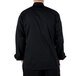 A man wearing a black Mercer Culinary long sleeve chef jacket.