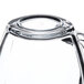 A close up of a Libbey clear glass square warm beverage mug.