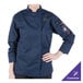 A woman wearing a Mercer Culinary navy long sleeve chef jacket.