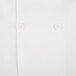 A close up of a Mercer Culinary white cook jacket with white buttons.