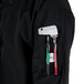 a person's pocket with a phone and pens