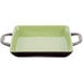 A green and brown square stoneware baking dish with handles.