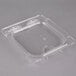 A clear plastic Carlisle food pan lid with a notch.