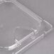 A Carlisle clear plastic food pan lid with a notch.