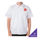 A man wearing a white Mercer Culinary cook shirt with a red logo.