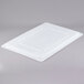 A white plastic Carlisle food storage lid.