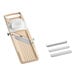 A beige Japanese mandoline slicer with a hand guard and three interchangeable blades.