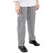 A woman wearing Mercer Culinary Genesis Houndstooth Cargo Pants standing in front of a white background.