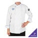 A man wearing a white Mercer Culinary chef jacket with royal blue piping.