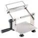 A stainless steel and black metal and plastic vegetable slicer with a handle.