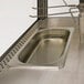 A Benchmark USA humidified countertop pizza warmer with stainless steel trays.