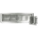 A stainless steel floor trough with a stainless steel grate over the drain.