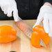 a person cutting vegetables with a knife