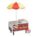 A small stainless steel hot dog cart with a red and yellow umbrella, featuring a sign that reads 'Tasty Hot Dogs' and images of hot dogs on the side.