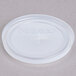 A white plastic lid with text that reads "Cambro Clear" and a cross over a line.