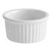 An Acopa bright white fluted porcelain ramekin.