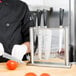 A chef cutting tomatoes with a Mercer Culinary Z&#252;M knife.