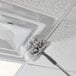 A Unger cobweb duster cleaning the ceiling