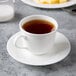 A Reserve by Libbey bone china tea cup with tea on a plate.