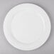 a white plate with a silver spoon