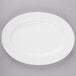 A white bone china oval platter with a white rim.