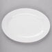 A white oval platter on a gray surface.