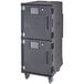 A charcoal grey Cambro food holding cabinet with wheels.