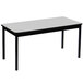 a white rectangular table with black legs