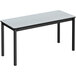 A white rectangular Correll lab table with a gray granite top and black legs.