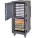 A large grey Cambro Pro Cart Ultra food holding cabinet with trays of food inside.