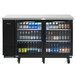 A Turbo Air Super Deluxe narrow back bar refrigerator with glass doors holding bottles of beer.