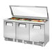 A True refrigerated sandwich prep table with a hinged glass lid on a counter.