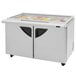 A Turbo Air 60" 2 door refrigerated sandwich prep table with glass lids open showing food.