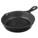 A black skillet with a handle.