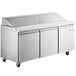 An Avantco stainless steel refrigerated sandwich prep table with three doors on wheels.