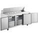 An Avantco stainless steel refrigerated sandwich prep table with two doors open.