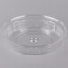 A clear plastic container with a round lid.