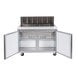 An Avantco stainless steel refrigerated sandwich prep table with two doors open.