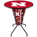 A round bar table with the University of Nebraska Cornhuskers logo on it.